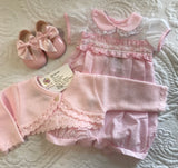 Baby girls pink slotted romper