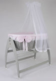 Miranda Quattro. Grey basket . Pink bedding .cot .