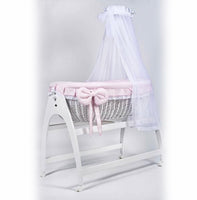 Miranda due. White basket. Pink bedding . Cot