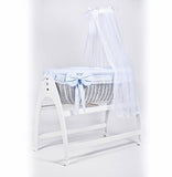 Miranda due. White wicker . Blue bedding . Cot