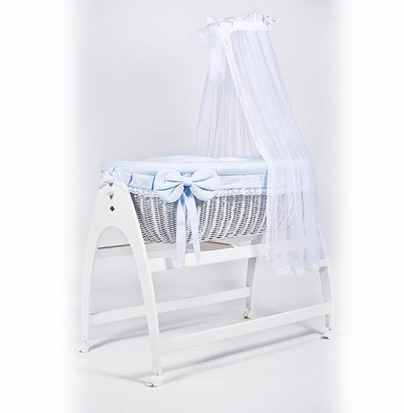 Miranda due. White wicker . Blue bedding . Cot