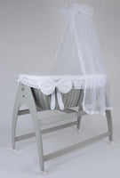 Miranda Quattro. Grey basket. White bedding. Cot .
